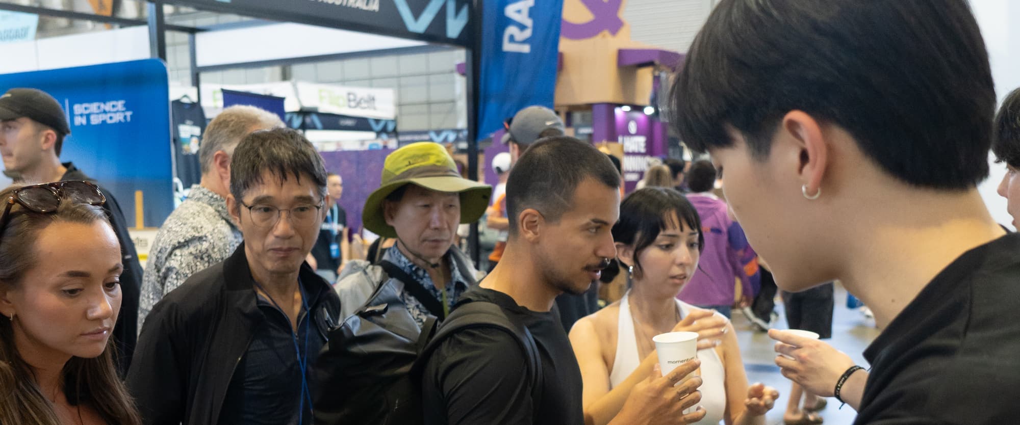 Visitors queueing for samples at the momentum stand
